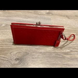 Coach embossed framed wristlet
